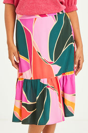 Model Luisa wearing size 14 of the Flitter Skirt in colour Geo (Pink), from the front, cropped image