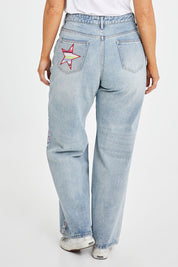 Model Laura wearing size 14 of the Patch Denim High Waisted Jeans in colour Denim (Blue), from the back