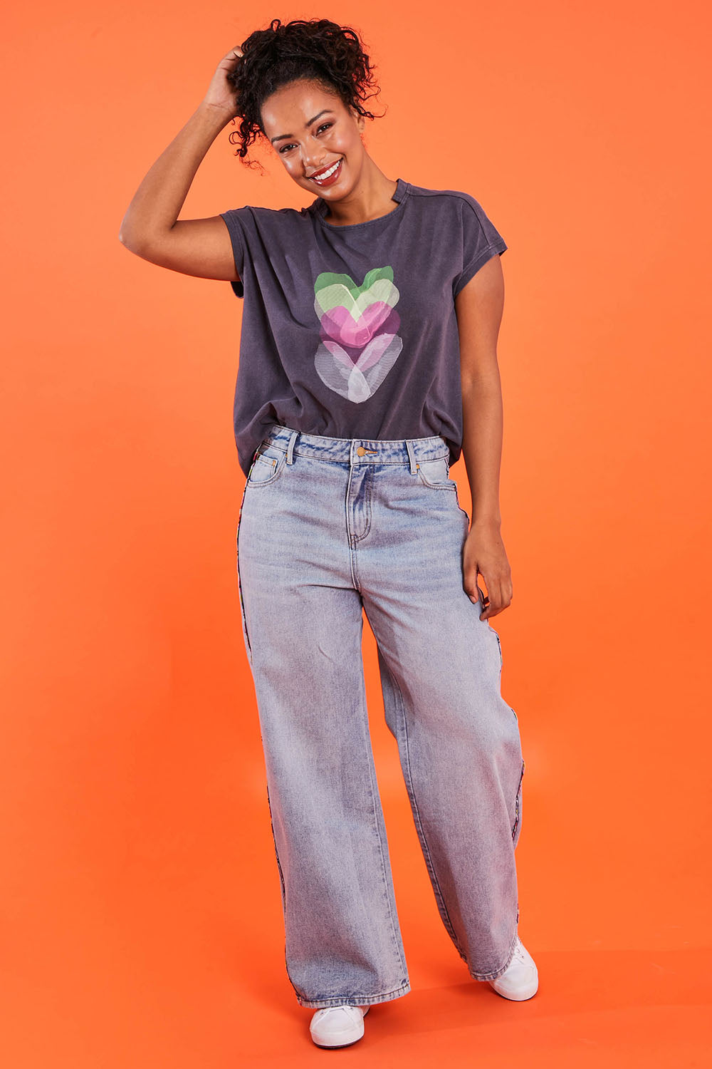 Model Noli wearing size 14 of the Patch Denim High Waisted Jeans in colour Denim (Blue), from the front, showing the whole outfit