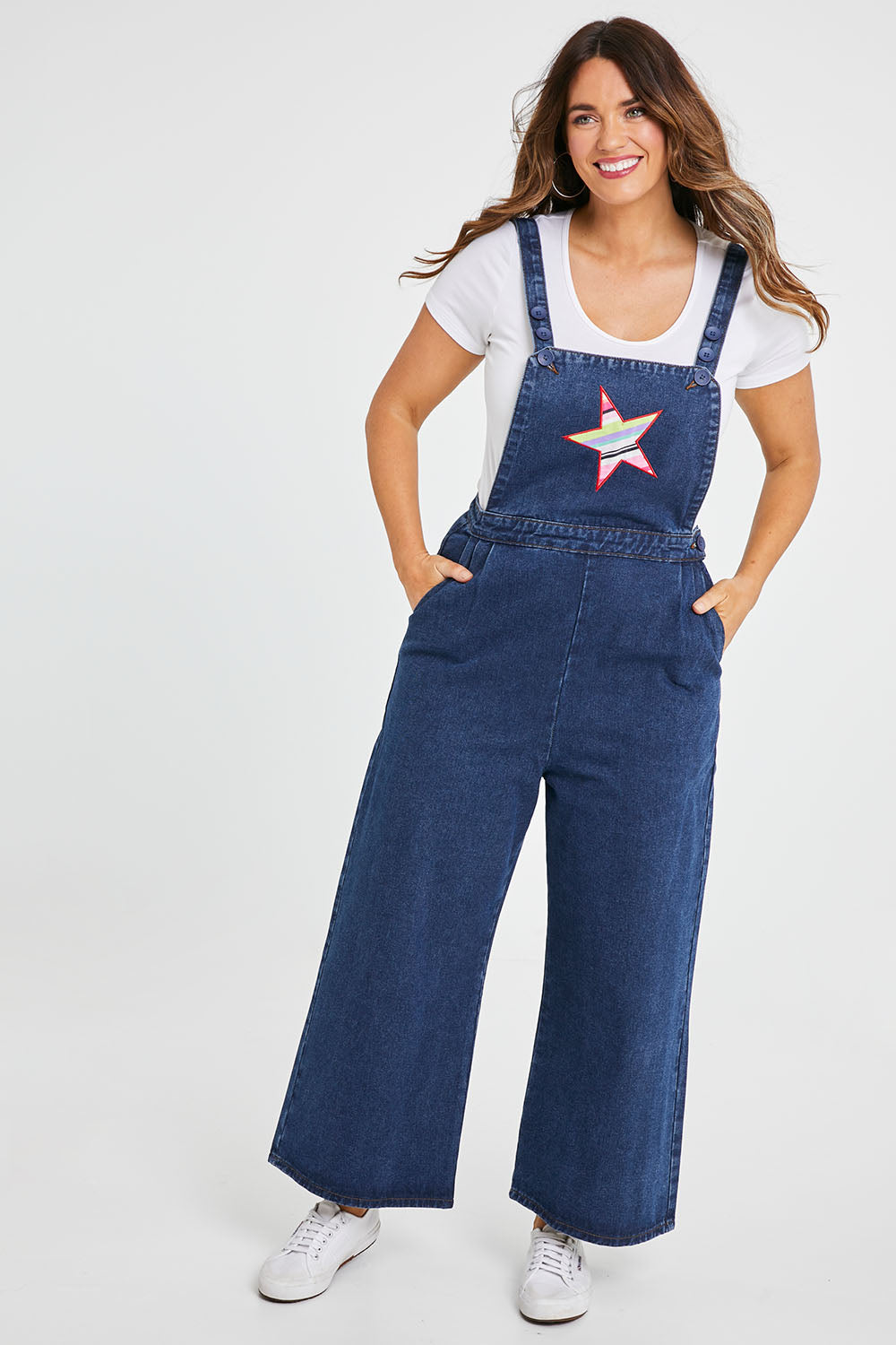 Model Laura wearing size 14 of the Star Overalls in colour Star (Blue), from the front, showing the whole outfit