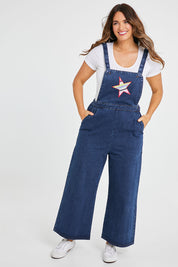 Model Laura wearing size 14 of the Star Overalls in colour Star (Blue), from the front, showing the whole outfit