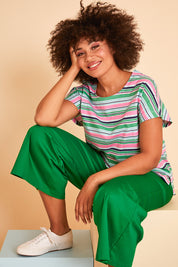 Model Olivia wearing size 10 of the Striped Slouch Top in colour Striped (White), from the front, showing the whole outfit