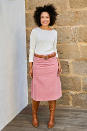 Model Olivia wearing size 10 of the A Line Cord Skirt in colour Pinkcord (Pink), from the front, showing the whole outfit