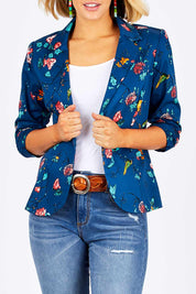 Model Emma wearing size 10 of the Printed Blazer in colour Blossom (Blue), from the front, cropped image