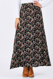 Model Anna wearing size 10 of the Printed Maxi Skirt in colour BlackFluer (Black), from the front, cropped image