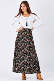Model Anna wearing size 10 of the Printed Maxi Skirt in colour BlackFluer (Black), from the front, showing the whole outfit