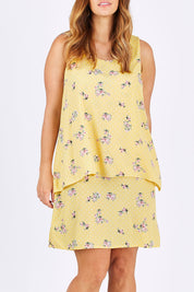 Model Laura wearing size 12 of the Tier Dress in colour Lemons, from the front, cropped image