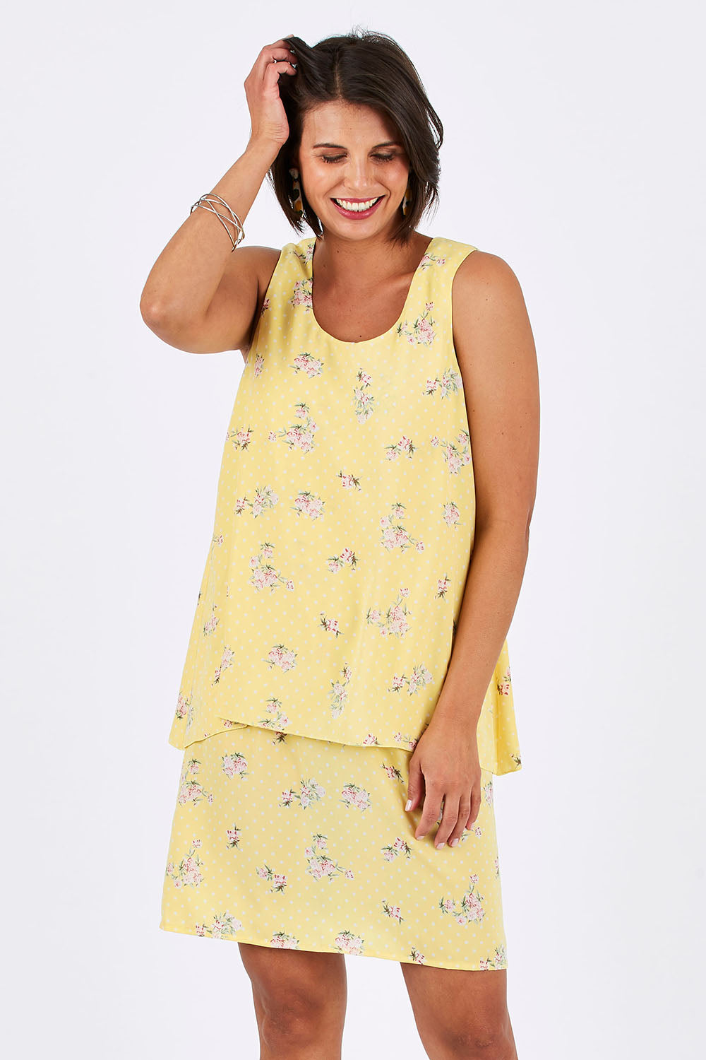 Model Thais wearing size 10 of the Tier Dress in colour Lemons, from the front, cropped image