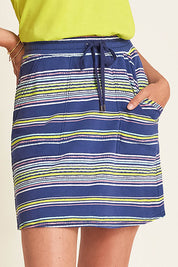 A model wearing the Christine Skirt in colour Stripes (Blue), from the front, cropped image