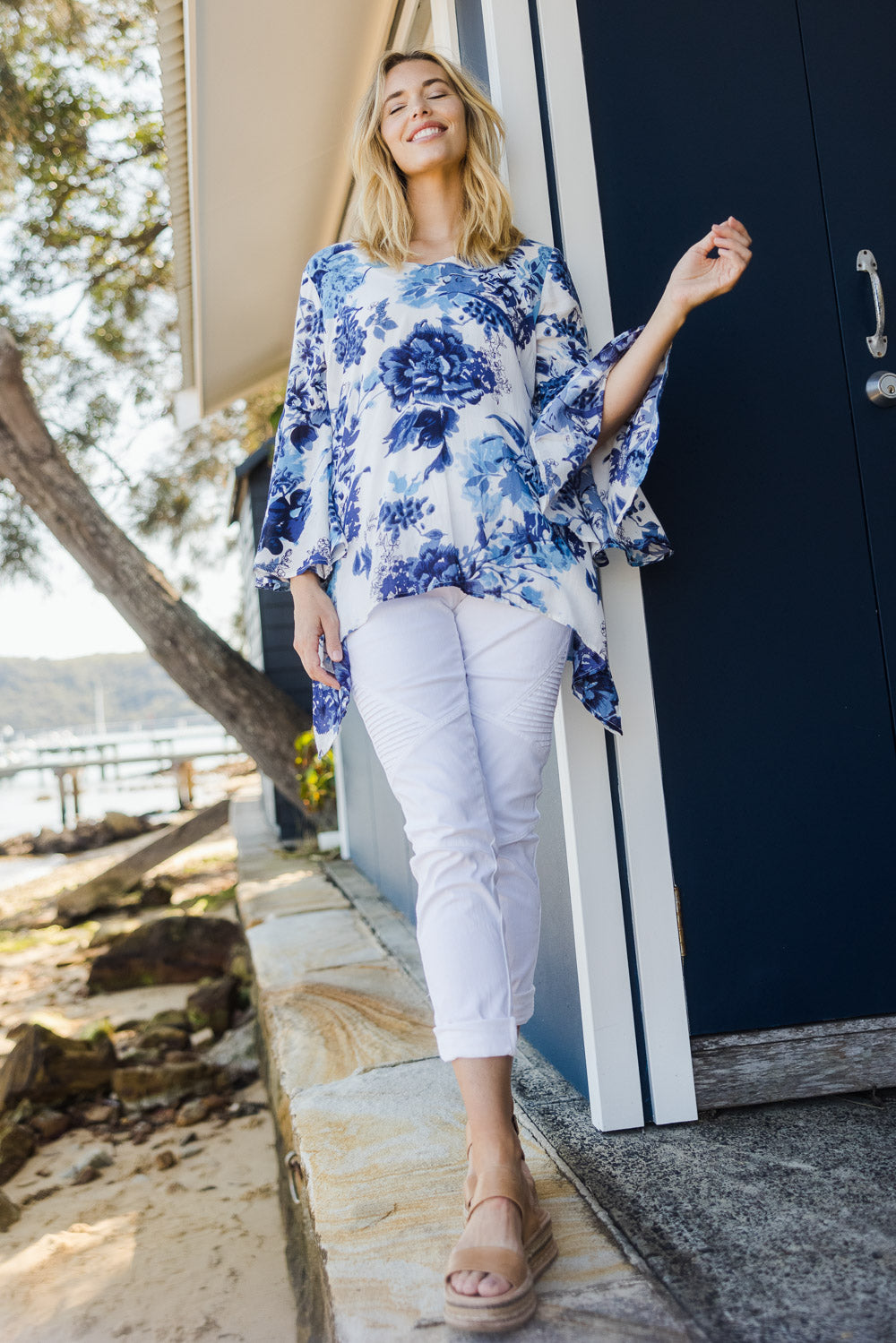 Model Phoebe wearing size S of the Cuba Top in colour Blueprint (Blue), from the front, showing the whole outfit