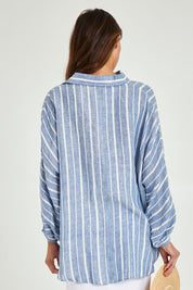 Model Madeline wearing the Cliffside Shirt in colour Nautstripe (Blue), from the back