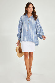 Model Madeline wearing the Cliffside Shirt in colour Nautstripe (Blue), from the front, showing the whole outfit