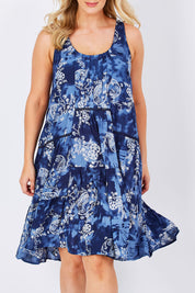 Model Jess wearing size M of the Mirimar Dress in colour Lantana (Blue), from the front, cropped image
