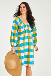 Model Stacey wearing size 10 of the Bloom Dress in colour Checkocean (Blue), from the front, cropped image
