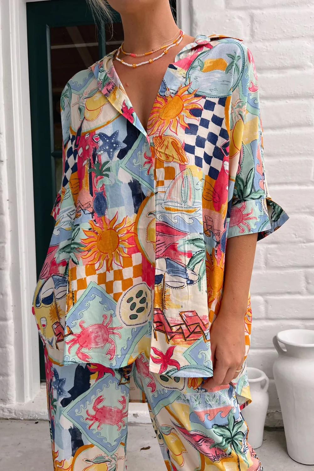 A model wearing the River Shirt in colour Multi (White), from the front, cropped image