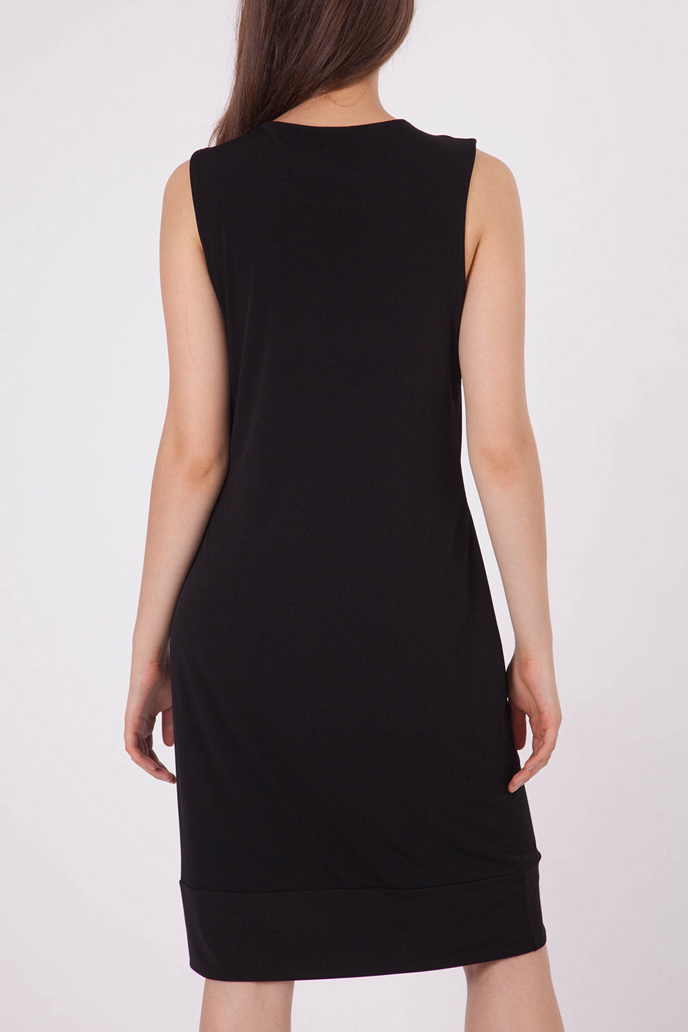 A model wearing the Lexington Panel Detail Dress in colour Prints (Black), from the back