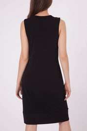 A model wearing the Lexington Panel Detail Dress in colour Prints (Black), from the back