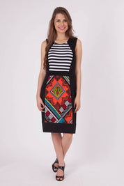 A model wearing the Lexington Panel Detail Dress in colour Prints (Black), from the front, showing the whole outfit