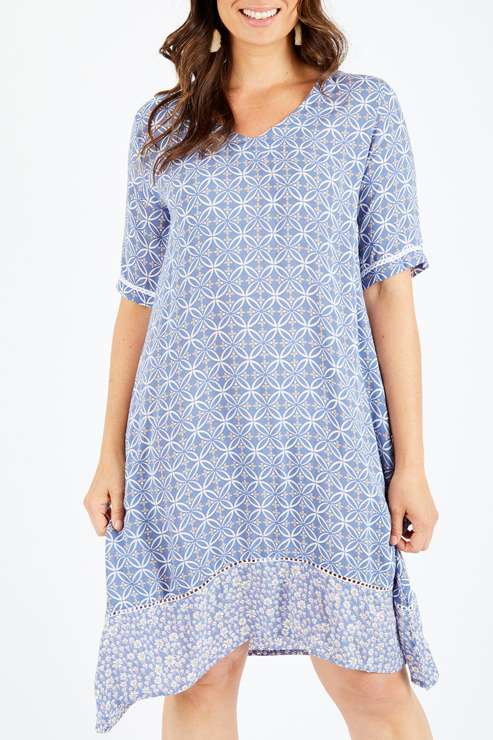 Model Shadae wearing size 10 of the Safina Dress in colour Bluedenim (Blue), from the front, cropped image