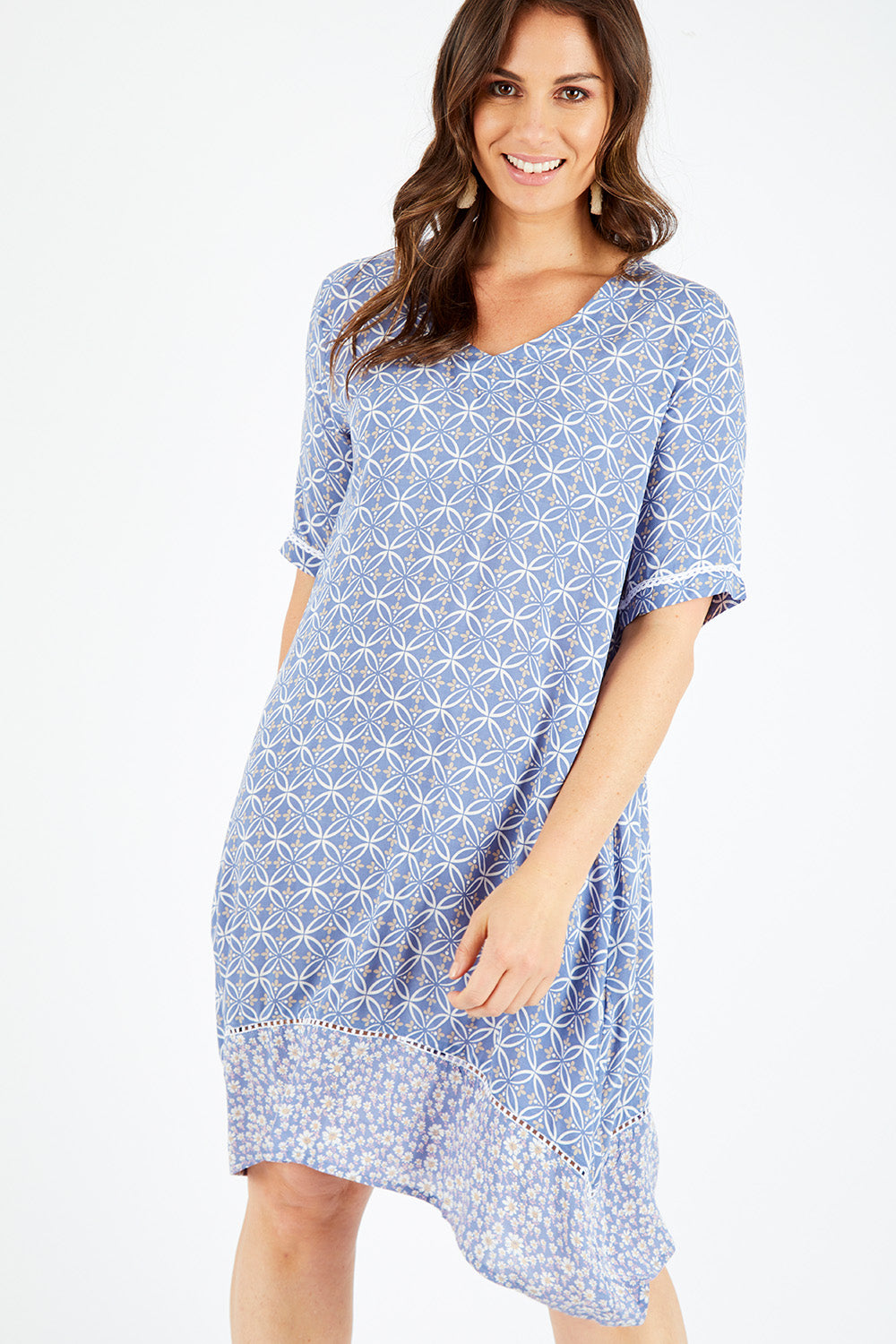 Model Shadae wearing size 10 of the Safina Dress in colour Bluedenim (Blue), from the front, cropped image