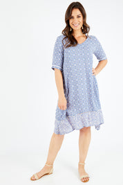 Model Shadae wearing size 10 of the Safina Dress in colour Bluedenim (Blue), from the front, showing the whole outfit