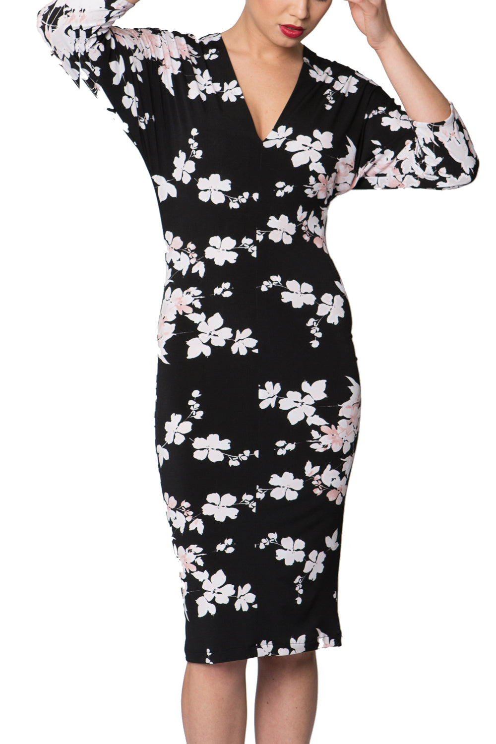 A model wearing the Kimbra Dress in colour Petal (Black), from the front, cropped image