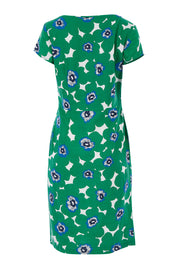 Product shot of the St Austell Dress in colour Modrnflorl (Green), from the back
