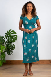 A model wearing the Wrap Midi Dress in colour Darkteal (Green), from the front, showing the whole outfit