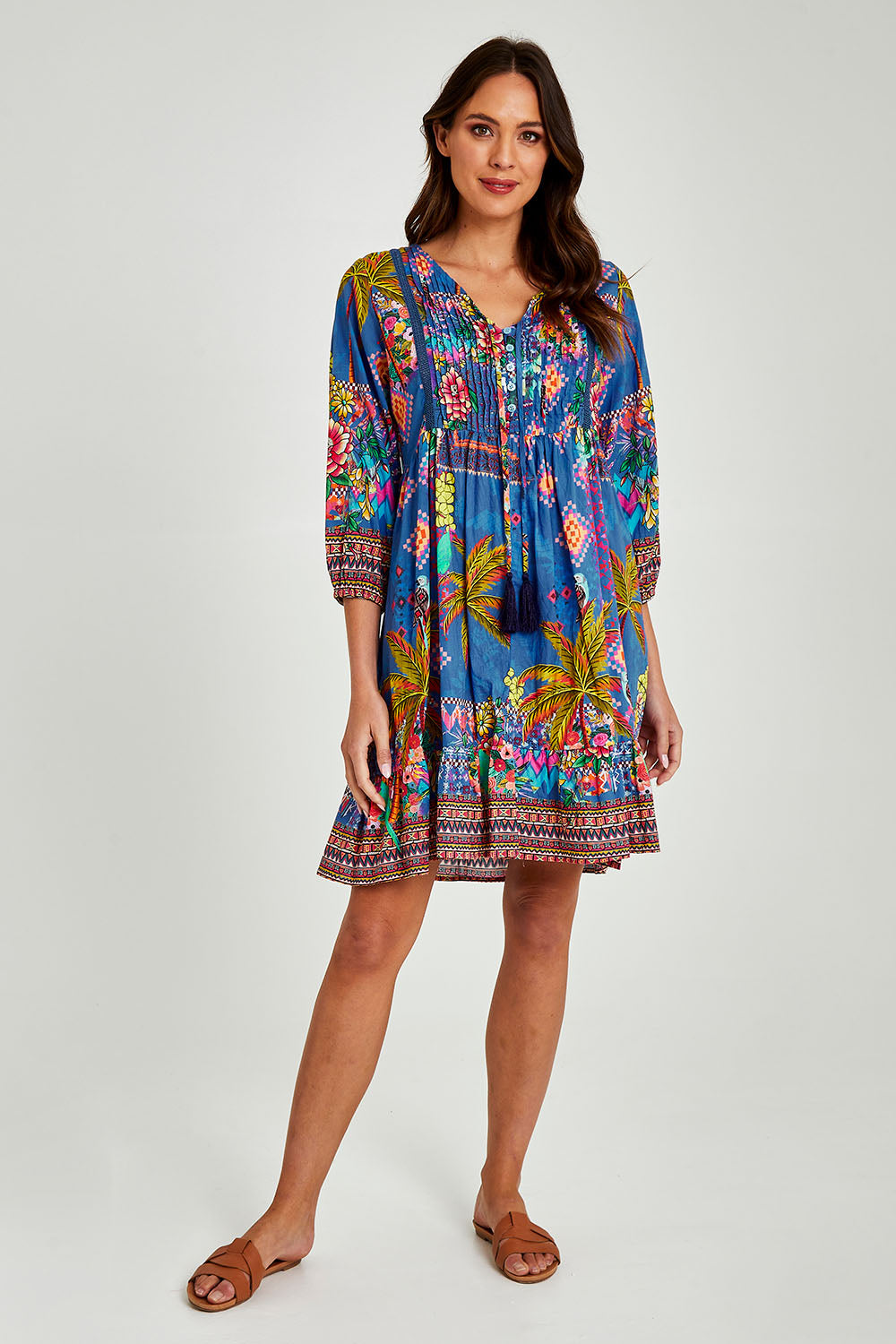 Model Madeline wearing size S of the Mika Dress in colour Ocean (Blue), from the front, showing the whole outfit