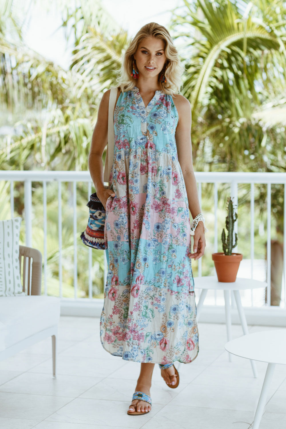 A model wearing the Sayan Maxi Dress in colour Multi (Blue), from the front, showing the whole outfit