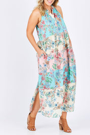 Model Jess wearing size L of the Sayan Maxi Dress in colour Multi (Blue), from the front, cropped image