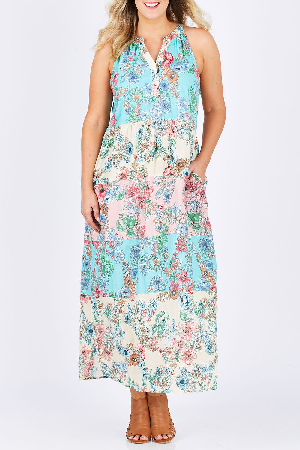 Model Jess wearing size L of the Sayan Maxi Dress in colour Multi (Blue), from the front, cropped image