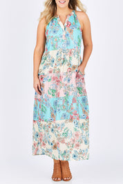 Model Jess wearing size L of the Sayan Maxi Dress in colour Multi (Blue), from the front, cropped image