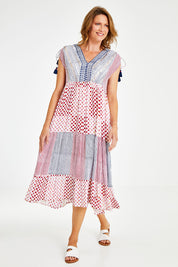 Model Naomi wearing size S of the Carly Midi in colour Navy (Blue), from the front, showing the whole outfit