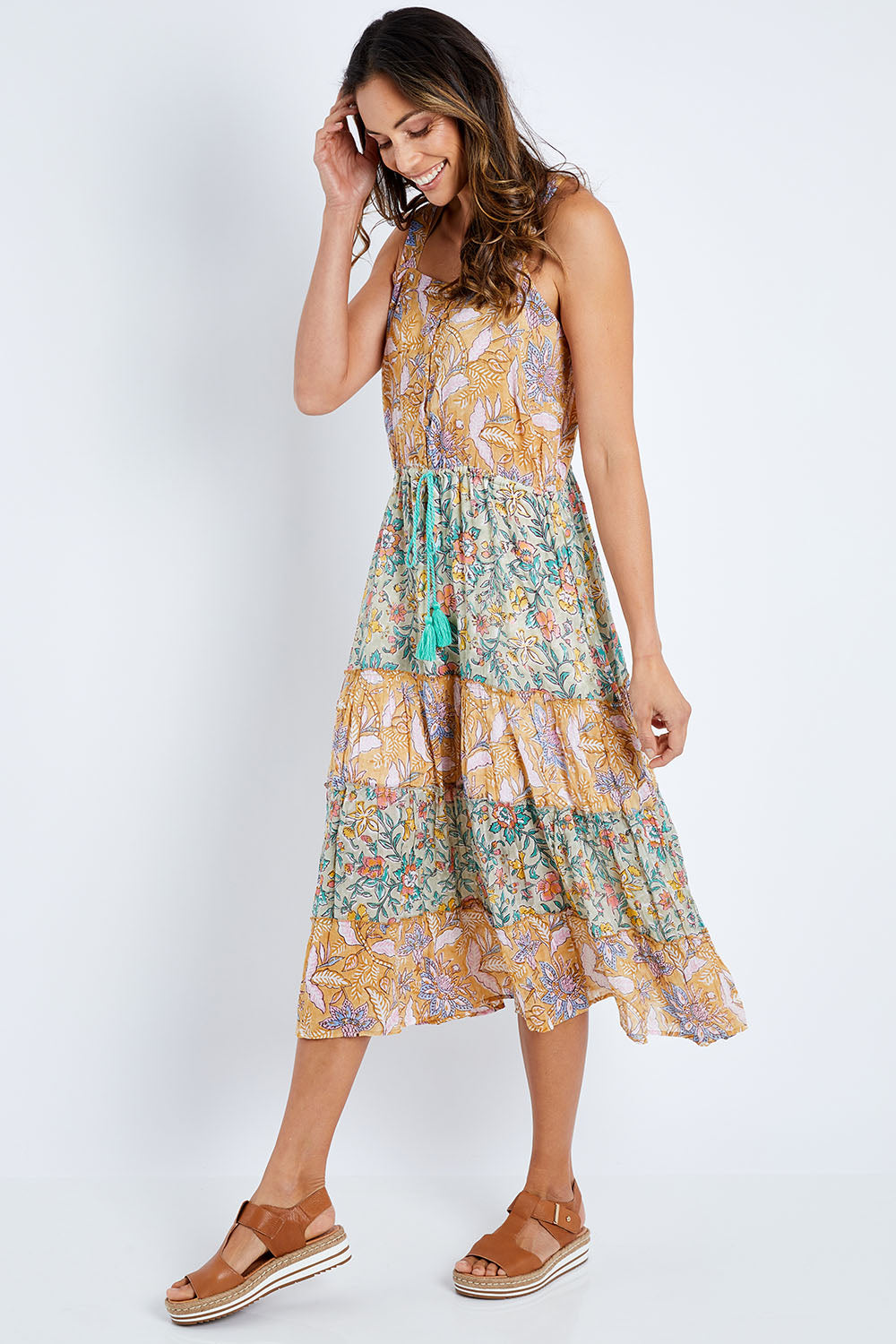 Model Amanda wearing size S of the Gaby Sundress in colour Sage, from the front, showing the whole outfit