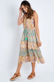 Model Amanda wearing size S of the Gaby Sundress in colour Sage, from the front, showing the whole outfit