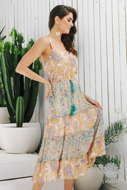 A model wearing the Gaby Sundress in colour Sage, from the front, showing the whole outfit