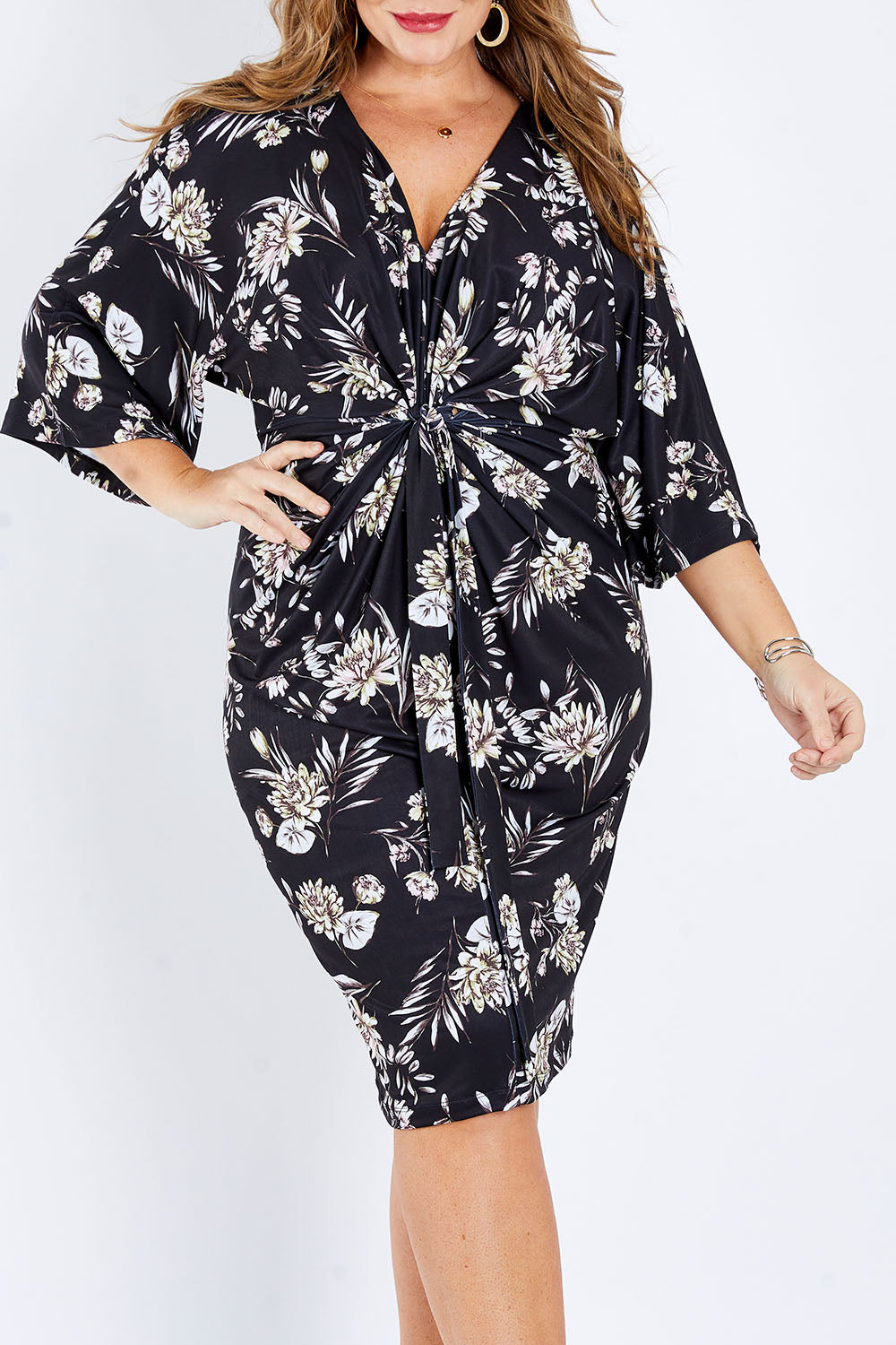 Model Fiona wearing size 16 of the Georgia Dress in colour Dahlia (Black), from the front, cropped image