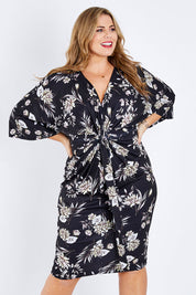 Model Fiona wearing size 16 of the Georgia Dress in colour Dahlia (Black), from the front, cropped image