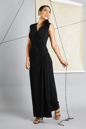 Model Pamela wearing size 10 of the Elisha Dress in colour Black (Black), from the front, showing the whole outfit
