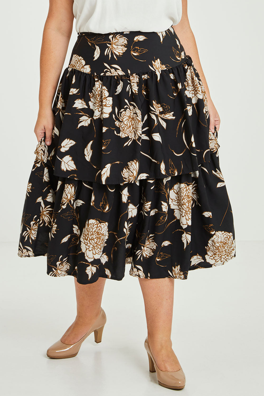 Model Fiona wearing size 16 of the Samara Skirt in colour Disbud (Black), from the front, cropped image