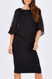 Model Monique wearing size 10 of the Cassi in colour Black (Black), from the front, cropped image