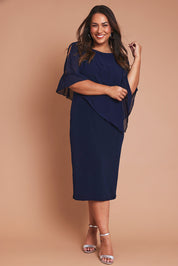 Model Ashleigh wearing size 16 of the Cassandra Dress in colour Navy (Blue), from the front, showing the whole outfit