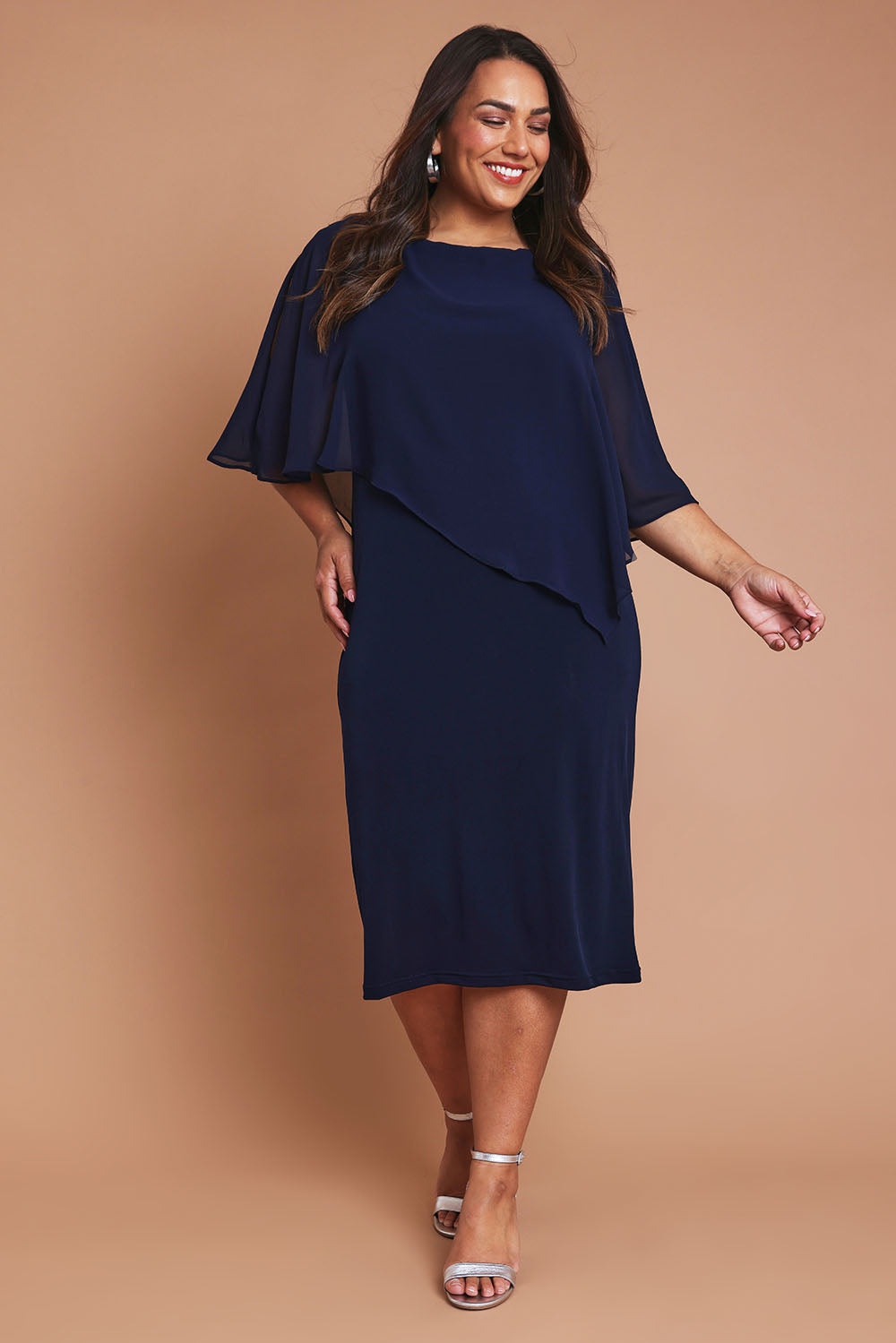 Model Ashleigh wearing size 16 of the Cassandra Dress in colour Navy (Blue), from the front, showing the whole outfit