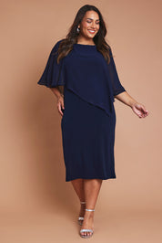 Model Ashleigh wearing size 16 of the Cassandra Dress in colour Navy (Blue), from the front, showing the whole outfit