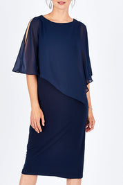 Model Rebecca wearing size 10 of the Cassandra Dress in colour Navy (Blue), from the front, cropped image