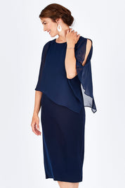 Model Rebecca wearing size 10 of the Cassandra Dress in colour Navy (Blue), from the front, cropped image
