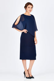 Model Rebecca wearing size 10 of the Cassandra Dress in colour Navy (Blue), from the front, showing the whole outfit