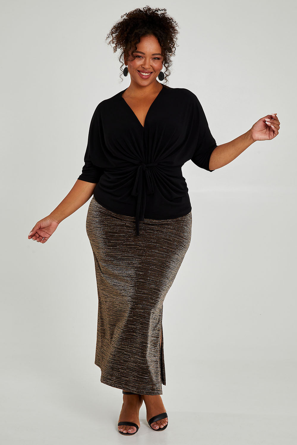 Model Alexis wearing size 16 of the Niamh Top in colour Black (Black), from the front, showing the whole outfit