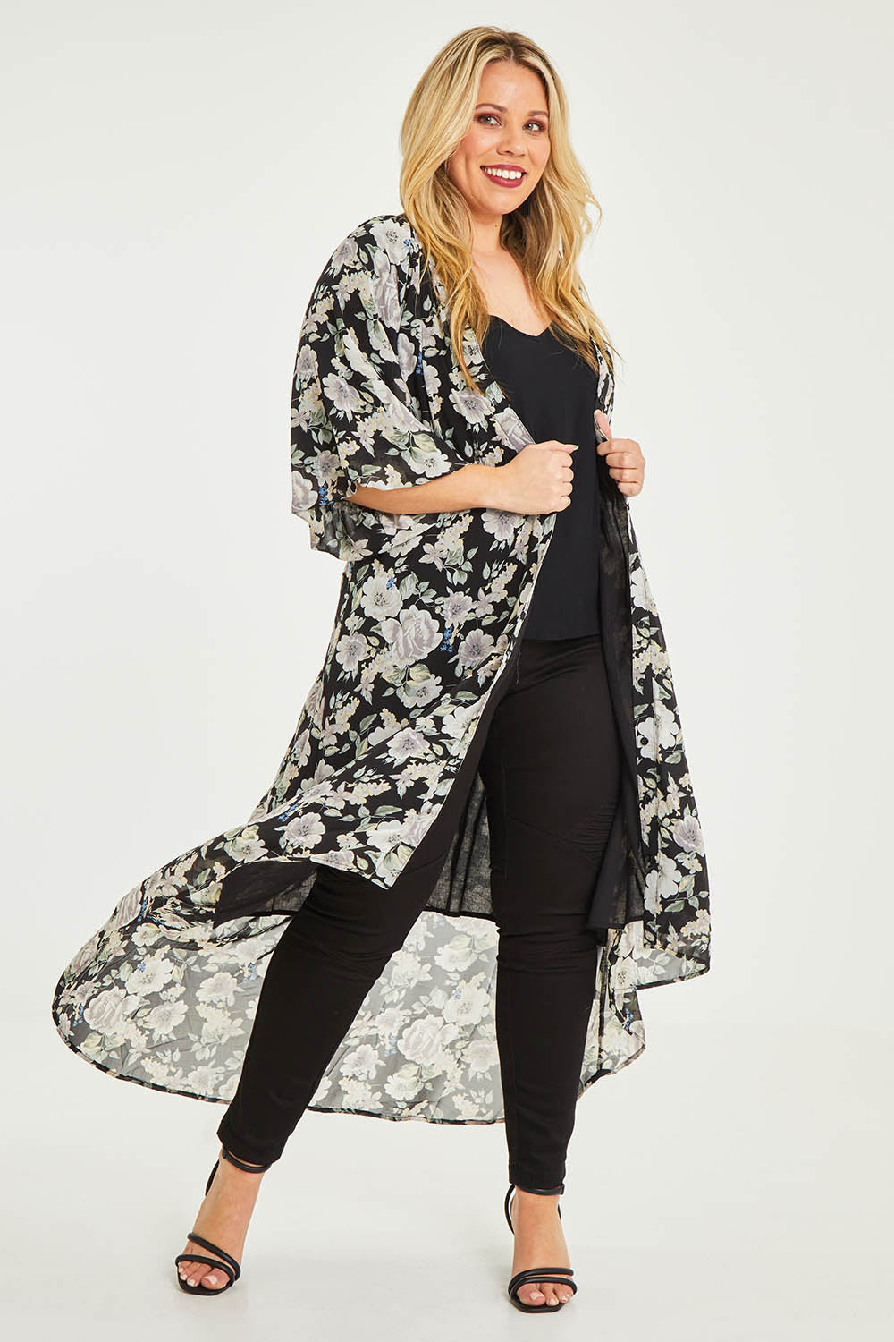 Model Katie wearing size 16 of the Natasha Dress in colour Floral (Black), from the front, showing the whole outfit